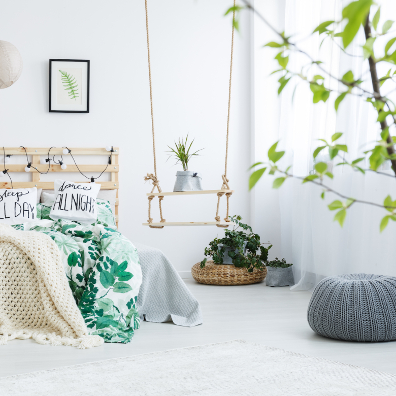 bedroom with gray pouf
